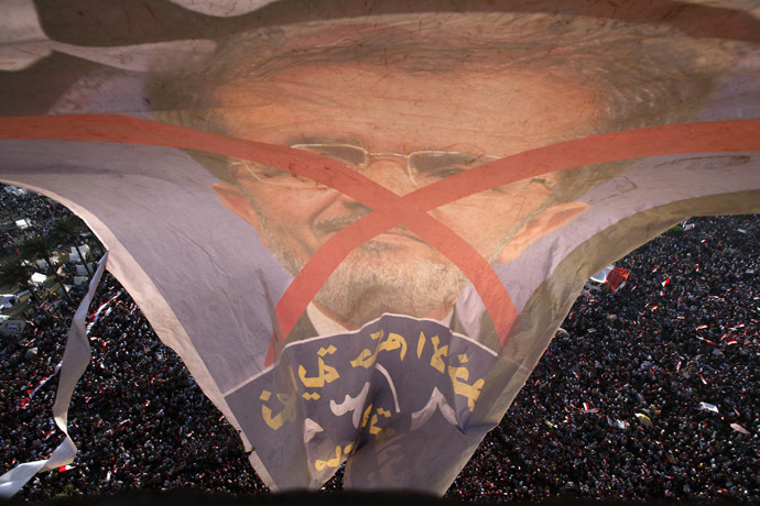 Protesters opposing
Egyptian President Mohamed Morsi shout slogans against him and
Brotherhood members during a protest at Tahrir Square in Cairo
June 30, 2013. (Reuters)