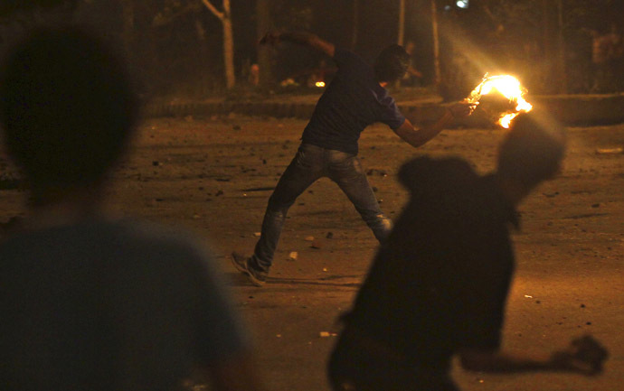 Protesters opposing Egyptian President
Mohamed Mursi throw Molotov cocktails and stones at the national
headquarters of the Muslim Brotherhood in Cairo's Moqattam
district June 30, 2013. (Reuters)